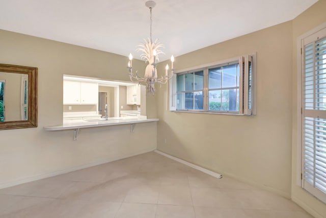 unfurnished dining area with light tile patterned floors and a chandelier