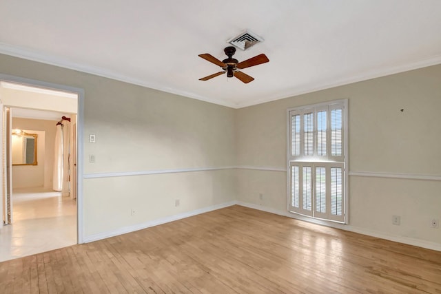 spare room with ceiling fan, light hardwood / wood-style floors, and ornamental molding