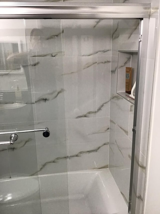 bathroom with an enclosed shower