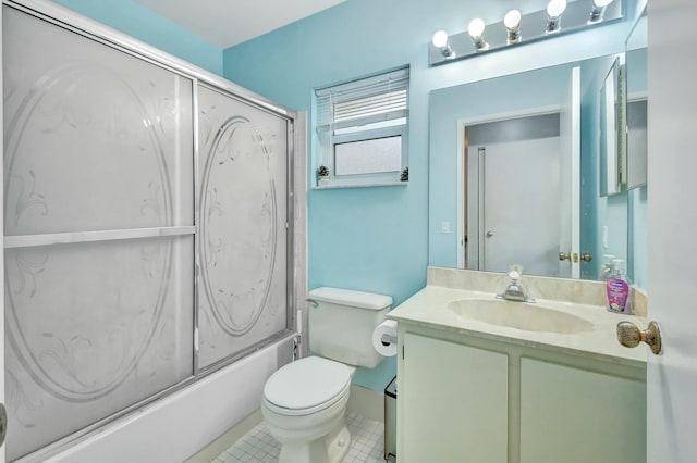 full bathroom featuring tile patterned floors, vanity, enclosed tub / shower combo, and toilet