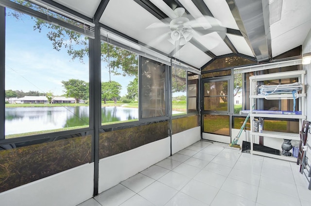 sunroom / solarium with a wealth of natural light, a water view, and lofted ceiling