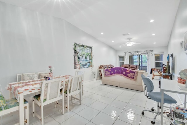 living room featuring ceiling fan, lofted ceiling, and light tile patterned flooring