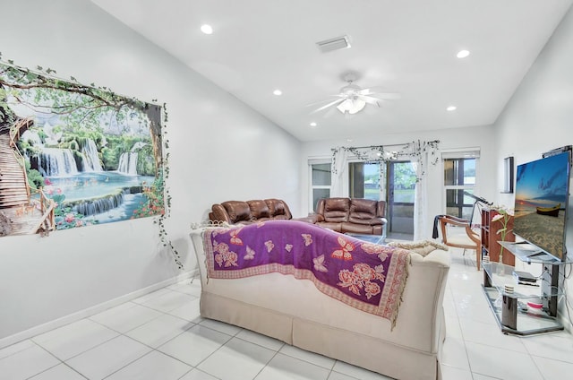 living room with light tile patterned floors, ceiling fan, and lofted ceiling