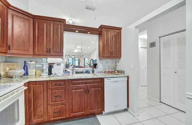 kitchen featuring backsplash, white appliances, ceiling fan, sink, and light tile patterned floors