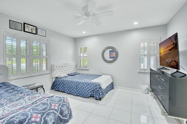 tiled bedroom with multiple windows and ceiling fan