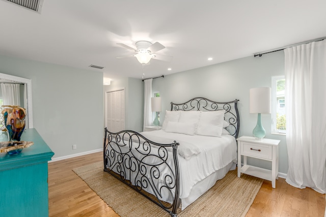 bedroom featuring ceiling fan and light hardwood / wood-style floors