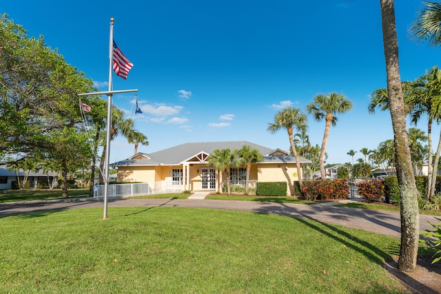 ranch-style home with a porch and a front lawn