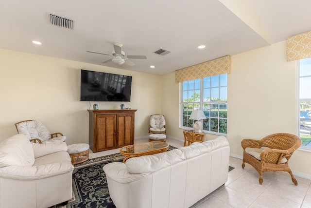 living room with ceiling fan and light tile patterned floors