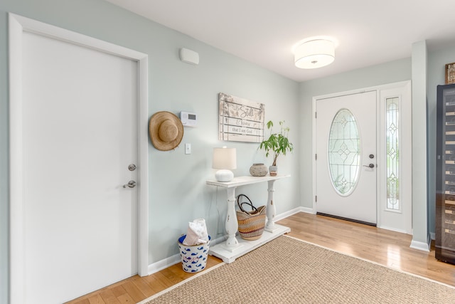 foyer entrance with hardwood / wood-style floors