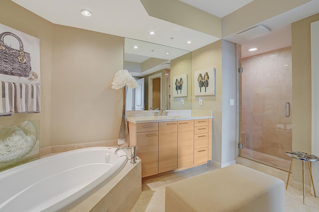 bathroom with tile patterned floors, vanity, and plus walk in shower