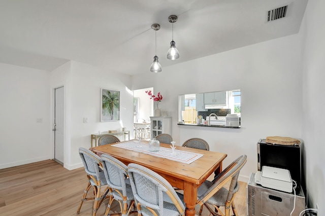 dining area with light hardwood / wood-style floors