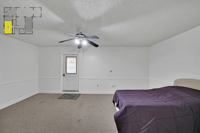 carpeted bedroom with ceiling fan and a textured ceiling