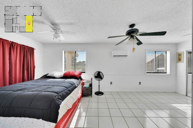 tiled bedroom featuring ceiling fan, an AC wall unit, a textured ceiling, and multiple windows