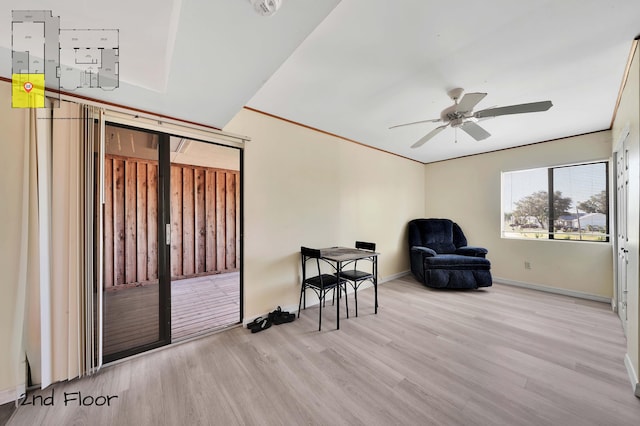 living area with ceiling fan and light wood-type flooring