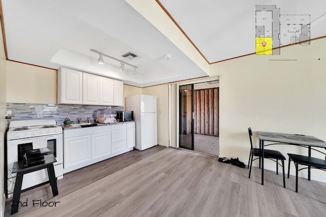 kitchen featuring white appliances, track lighting, tasteful backsplash, light hardwood / wood-style floors, and white cabinetry