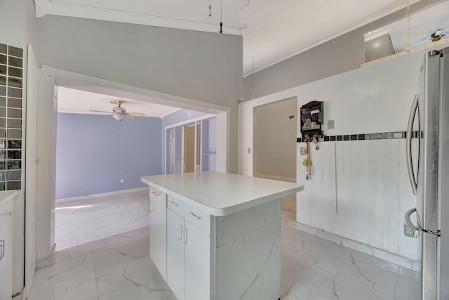 15230 SW 58th St, Miami, FL 33193 - kitchen featuring white cabinets, ceiling fan, ornamental molding, a kitchen island, and stainless steel refrigerator
