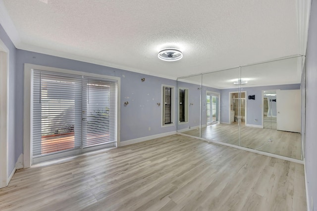 15230 SW 58th St, Miami, FL 33193 - unfurnished living room with a textured ceiling and light wood-type flooring