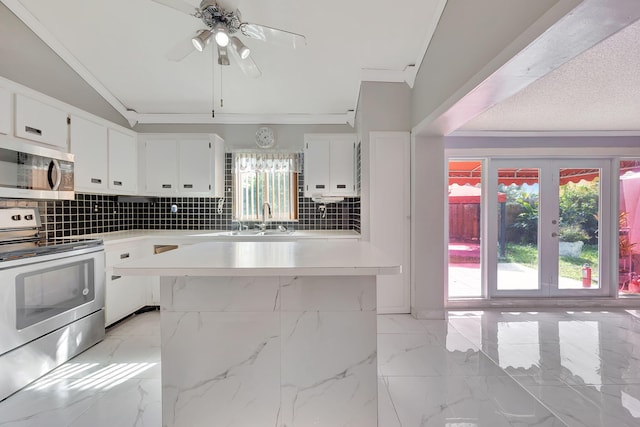 15230 SW 58th St, Miami, FL 33193 - kitchen with decorative backsplash, white cabinetry, ornamental molding, and electric range oven
