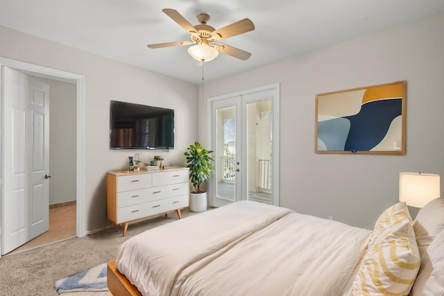 bedroom with access to outside, light colored carpet, and ceiling fan