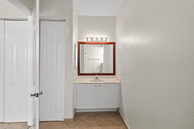 bathroom featuring vanity and tile patterned flooring