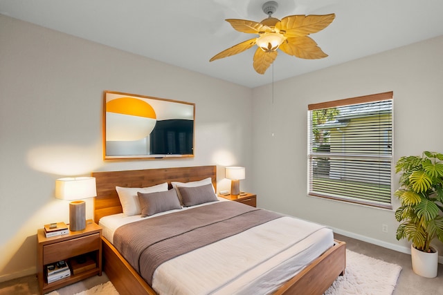 bedroom with ceiling fan and light carpet