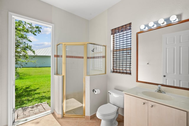 bathroom featuring toilet, a wealth of natural light, tile patterned floors, and walk in shower