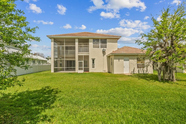 rear view of house with a lawn