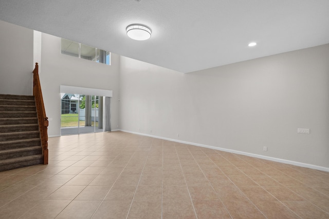 unfurnished room with light tile patterned floors