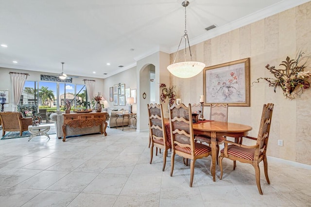 dining room featuring ceiling fan and ornamental molding