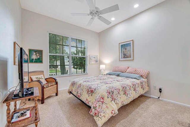 bedroom with ceiling fan and carpet floors