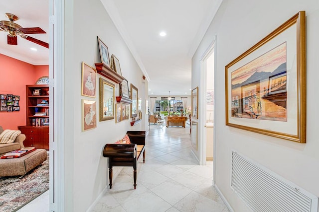 corridor featuring crown molding