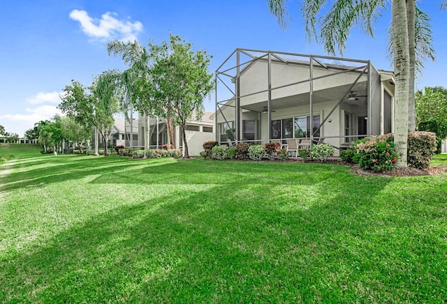 view of yard featuring glass enclosure