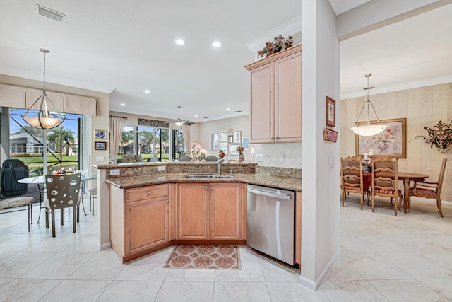 kitchen featuring kitchen peninsula, light stone counters, dishwasher, and sink