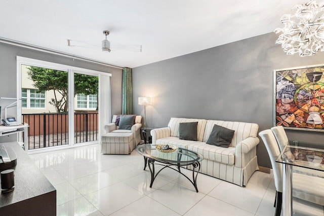 living room with light tile patterned flooring and ceiling fan with notable chandelier