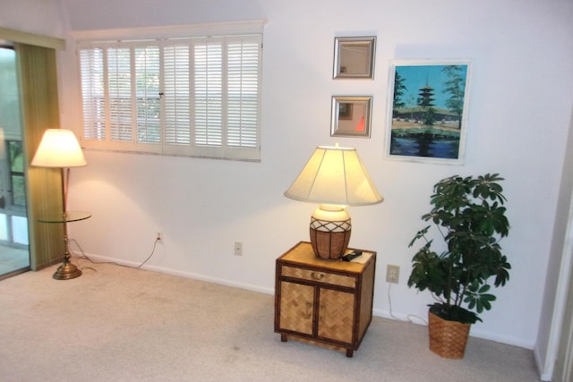 1225 NW 21st St Unit 3506, Stuart, FL 34994 - sitting room featuring carpet floors and baseboards