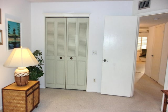 1225 NW 21st St Unit 3506, Stuart, FL 34994 - bedroom with light carpet and a closet