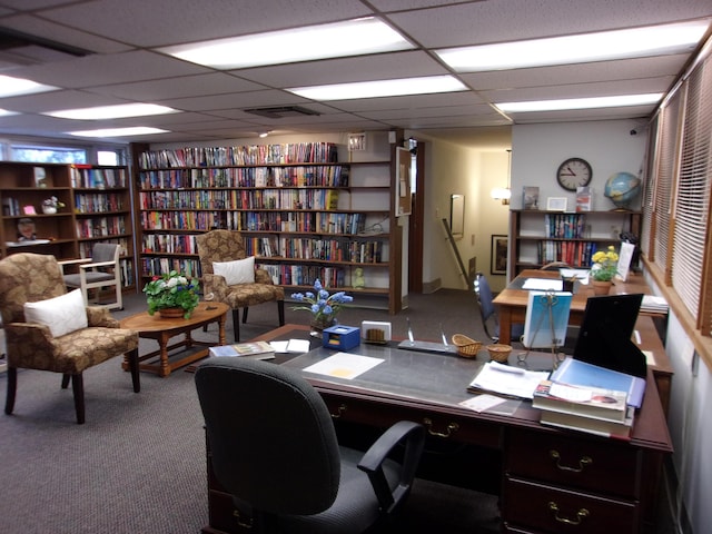 office featuring carpet and a paneled ceiling