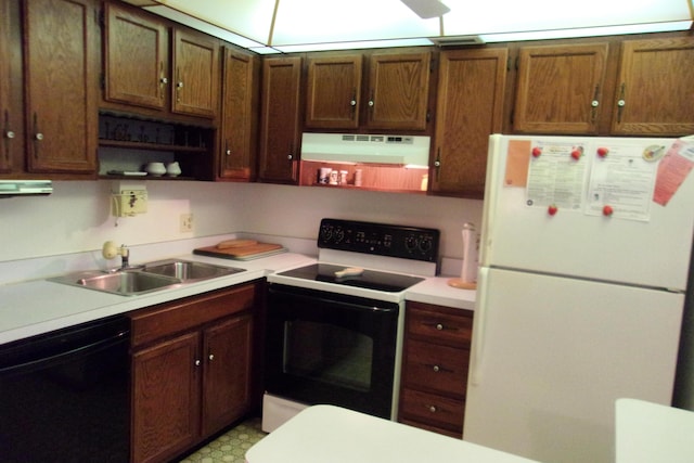 kitchen featuring white appliances and sink