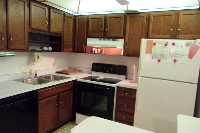 1225 NW 21st St Unit 3506, Stuart, FL 34994 - kitchen featuring freestanding refrigerator, dishwasher, range with electric stovetop, under cabinet range hood, and open shelves