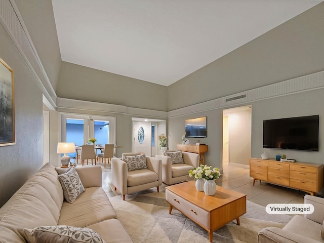 tiled living room with high vaulted ceiling