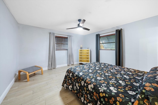 bedroom featuring light hardwood / wood-style floors and ceiling fan