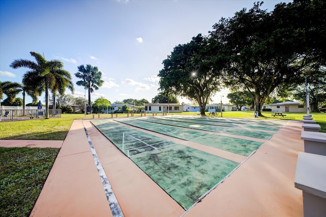 view of home's community featuring a lawn