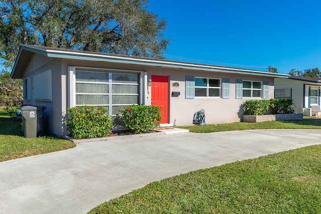 ranch-style home with a front yard