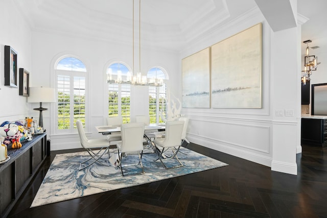 dining space featuring dark parquet floors, plenty of natural light, and ornamental molding