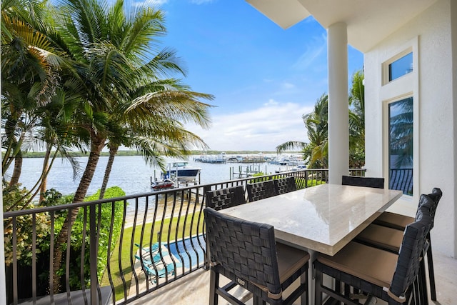 balcony featuring a water view