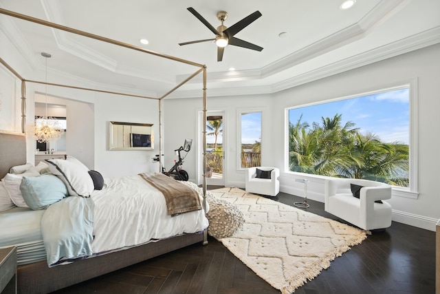 bedroom featuring a tray ceiling, ceiling fan, and crown molding