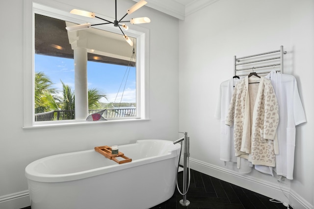 bathroom featuring crown molding and a bath