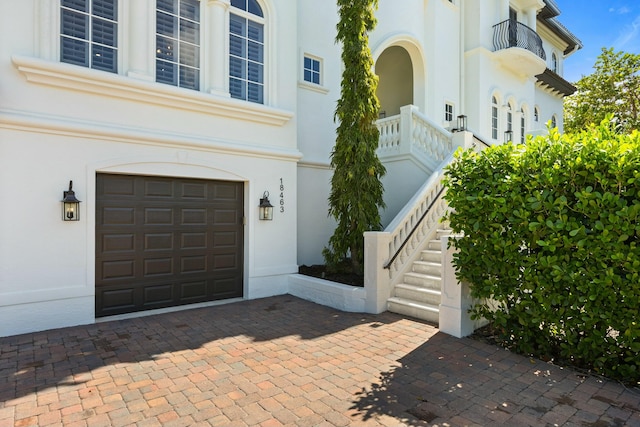 view of exterior entry featuring a garage