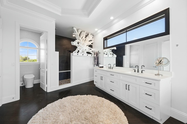 bathroom with hardwood / wood-style flooring, vanity, and crown molding