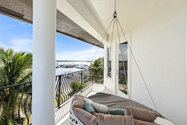 balcony featuring a water view